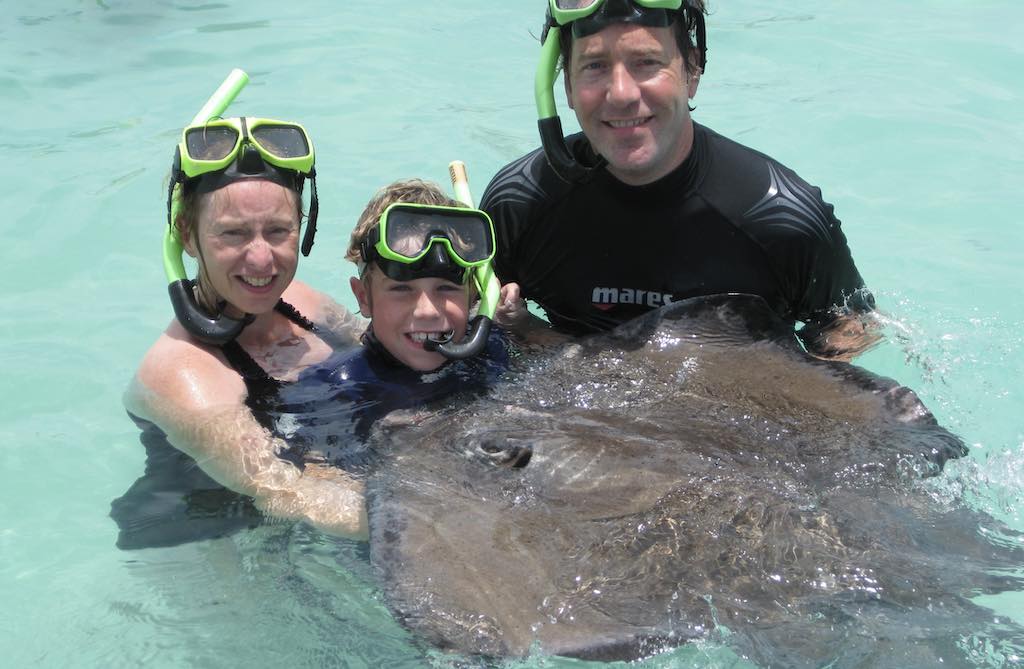 Swimming with my wife, young son and a charming friendly stingray at Stingray City off the West coast of Antigua.